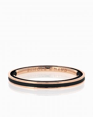 Rose gold hair tie bracelet with black enamel.